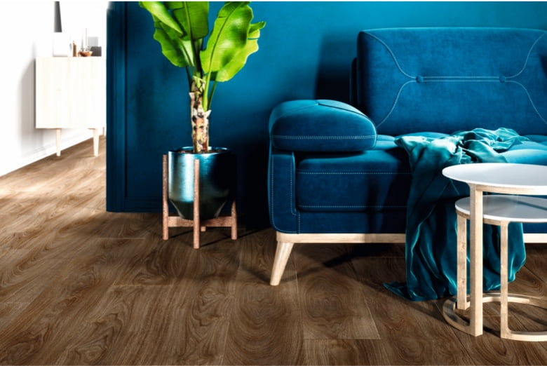 dark wood luxury vinyl tiles in living room with plant